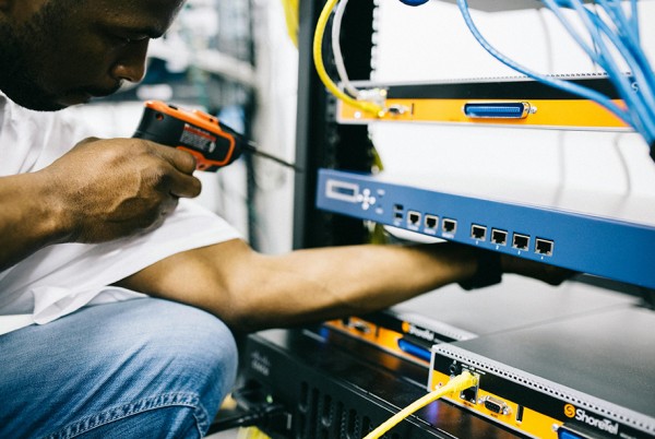 Technician working on IT equipment